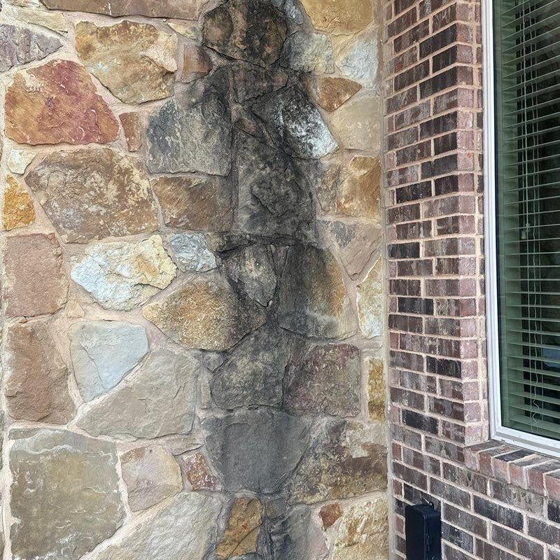 Stone veneer corner with masonry and brick interface Stone veneer corner with masonry and brick interface