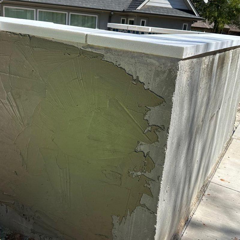 Stucco wall surface with partial application under sunlight Stucco wall surface with partial application under sunlight