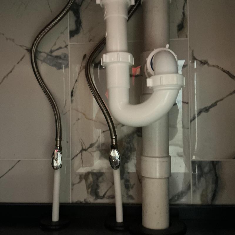 Bathroom sink P-trap and water supply lines installation