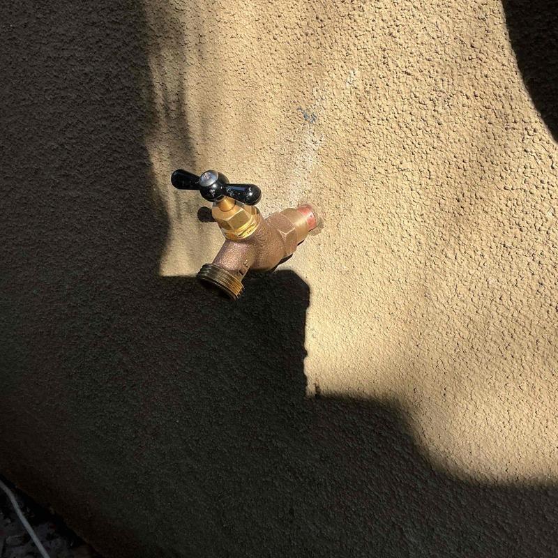 Exterior hose bib installation on stucco wall
