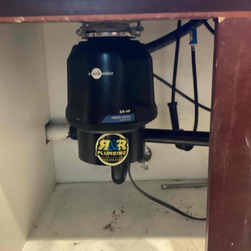 Garbage disposal unit installed under sink cabinet
