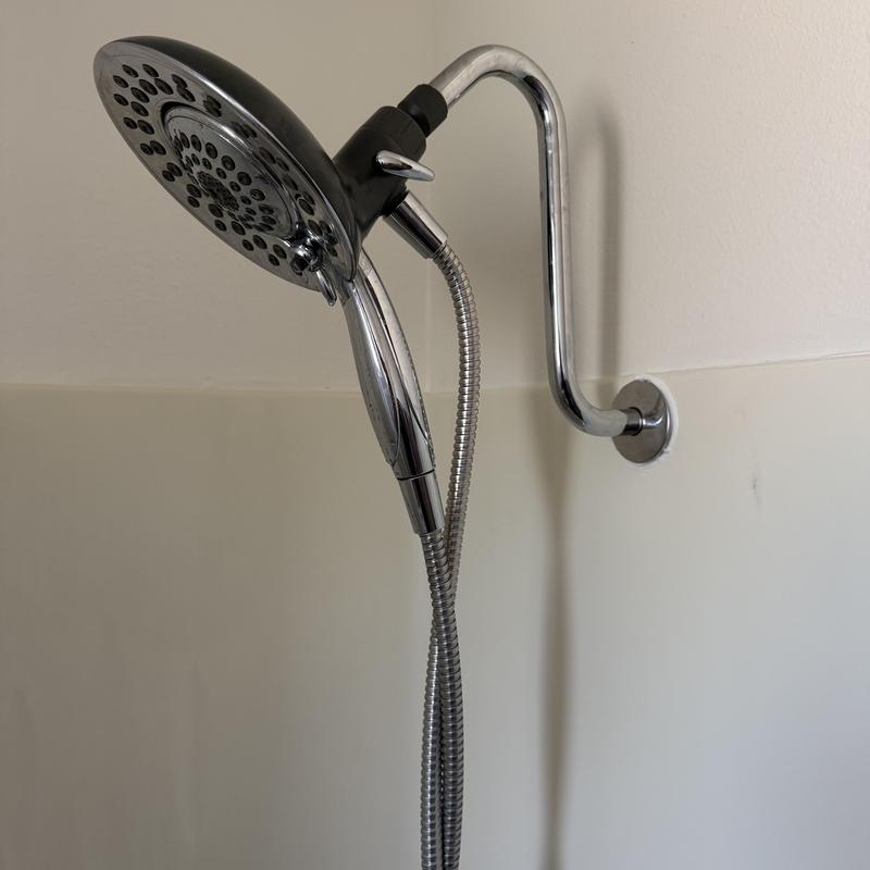 Showerhead with arm extension in master bathroom Showerhead with arm extension in master bathroom