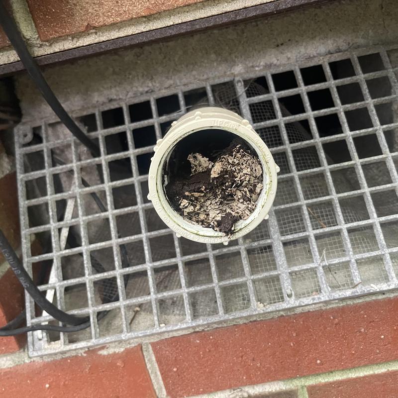 Sewer pipe clogged with debris and dirt blockage Sewer pipe clogged with debris and dirt blockage