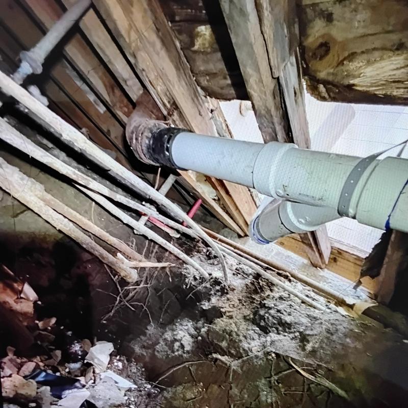 PVC drain pipe and cast iron pipe under home tunnel