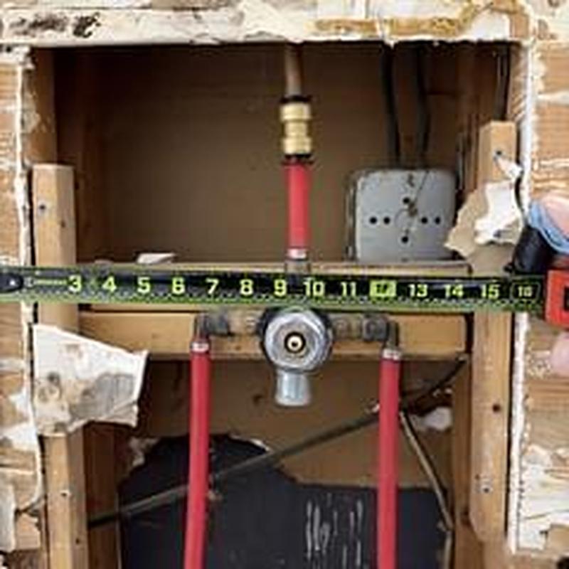 Wolverine brass tub shower faucet piping and measuring tape