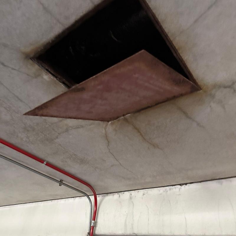 Stucco ceiling with open access panel and cracks Stucco ceiling with open access panel and cracks