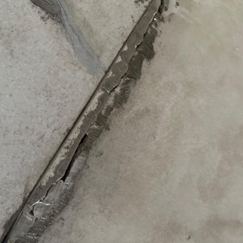 Stucco wall cracking and finish separation detail Stucco wall cracking and finish separation detail