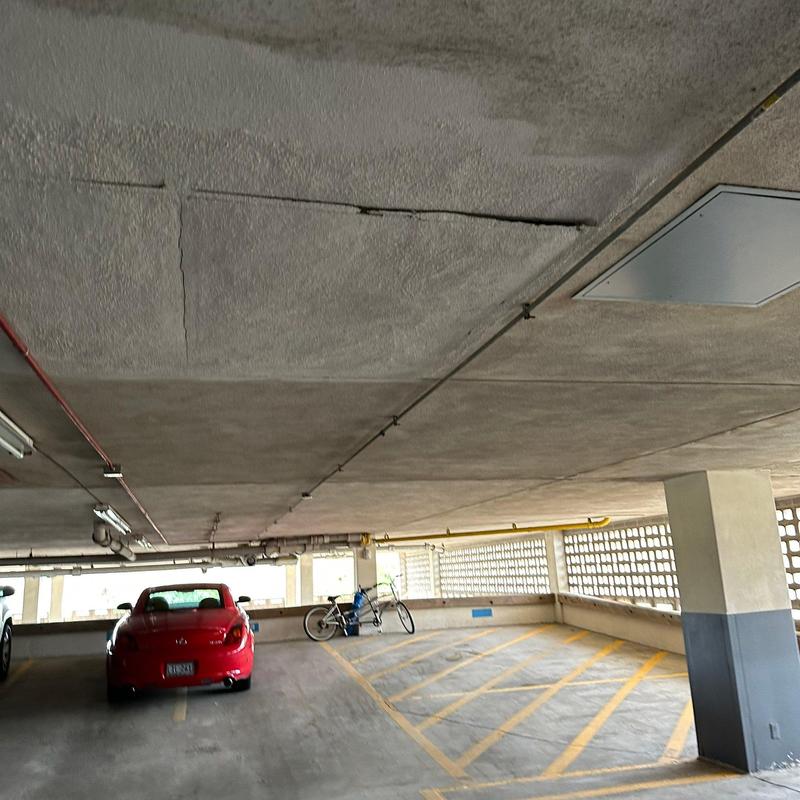 Stucco ceiling cracks and damage in parking garage Stucco ceiling cracks and damage in parking garage