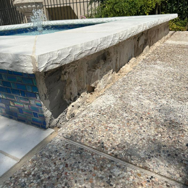 Pool concrete surround with blue tile and coping Pool concrete surround with blue tile and coping