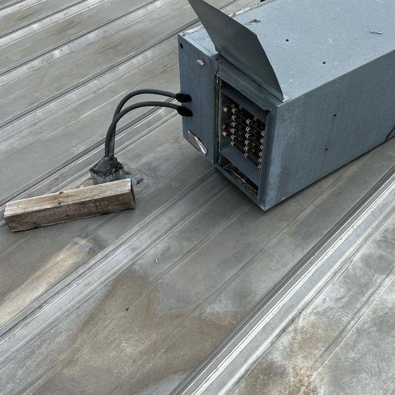 Metal roof with rooftop HVAC unit and wiring Metal roof with rooftop HVAC unit and wiring