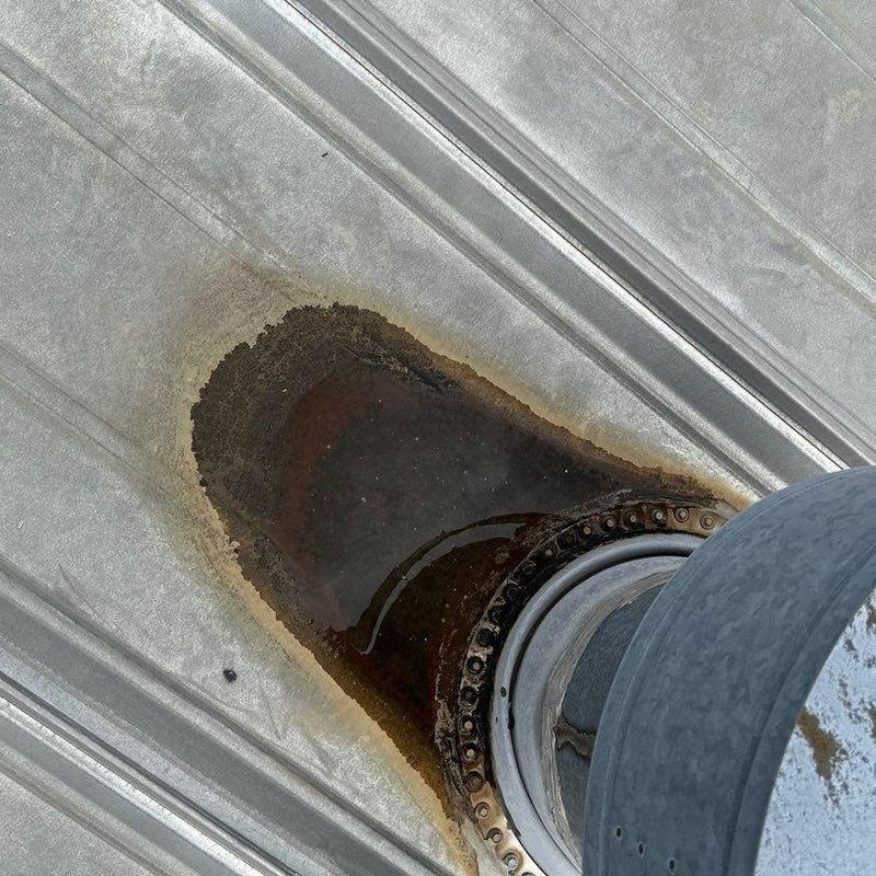 Metal roof penetration rust and water damage close-up Metal roof penetration rust and water damage close-up