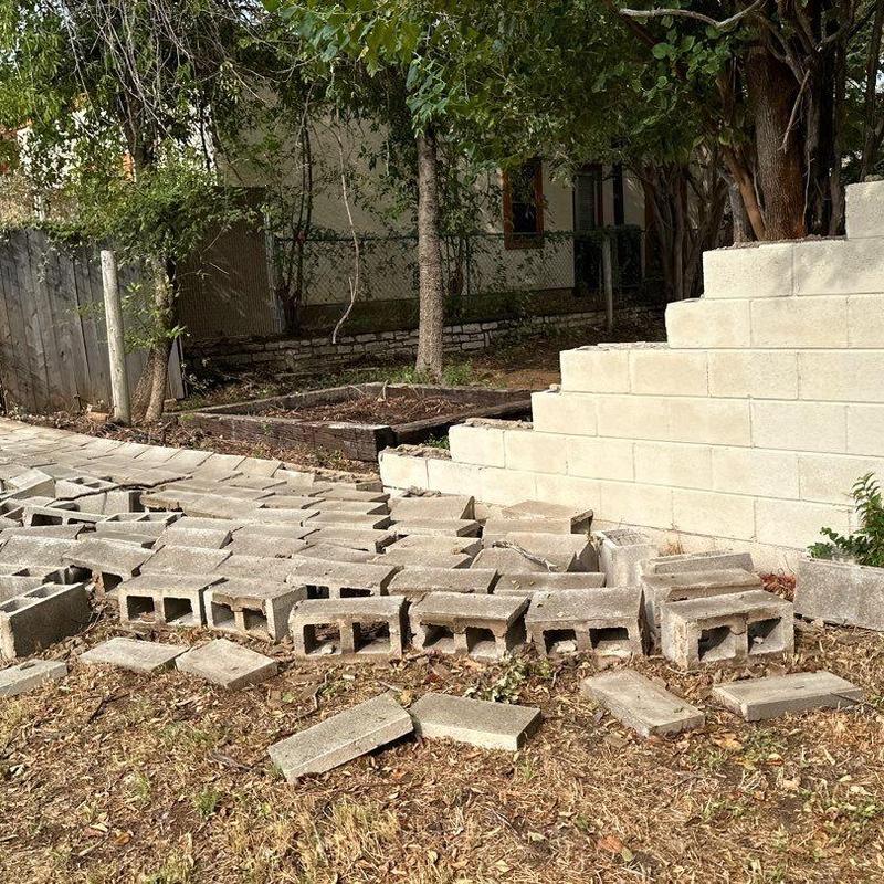 Block wall sections dismantled and stacked for rebuilding Block wall sections dismantled and stacked for rebuilding