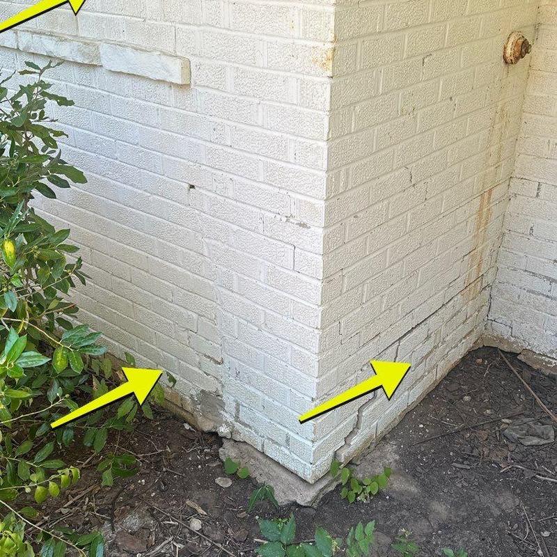 Brick wall masonry with cracks and damage Brick wall masonry with cracks and damage