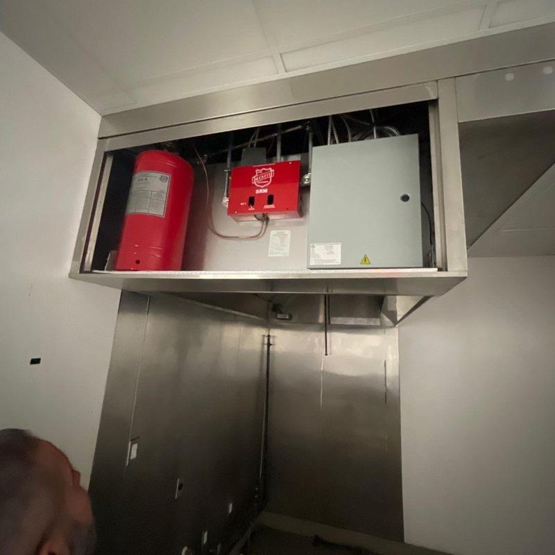 Fire suppression system control panel and tank installation Fire suppression system control panel and tank installation