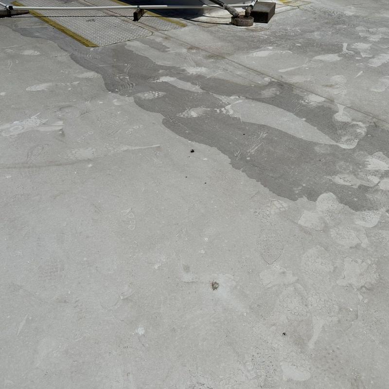 Concrete roof surface with patches and weathering signs Concrete roof surface with patches and weathering signs