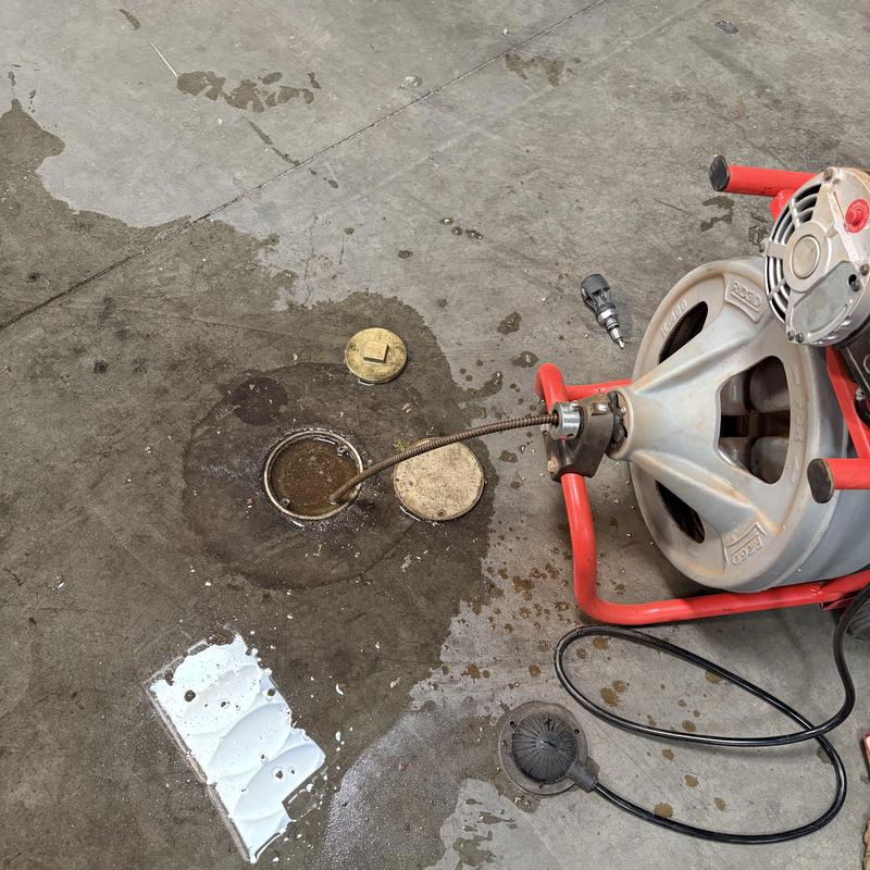 Cleanout sewer line with drain cleaning cable machine
