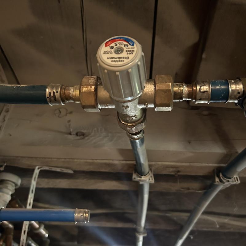 Mixing valve on water heater pipe system Mixing valve on water heater pipe system