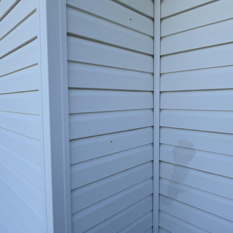 Vinyl siding panels on corner exterior wall