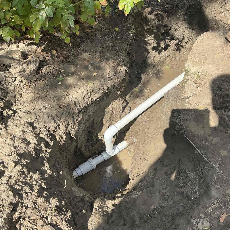 PVC water mainline piping with joint fittings in trench