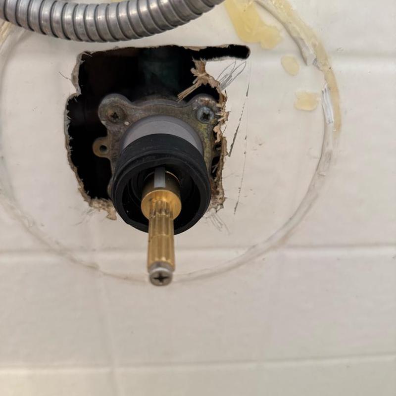 Shower valve cartridge removed from wall opening Shower valve cartridge removed from wall opening