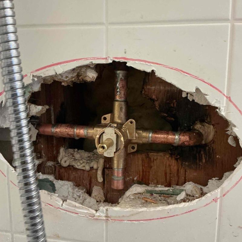 Shower valve and copper piping installed in wall cavity
