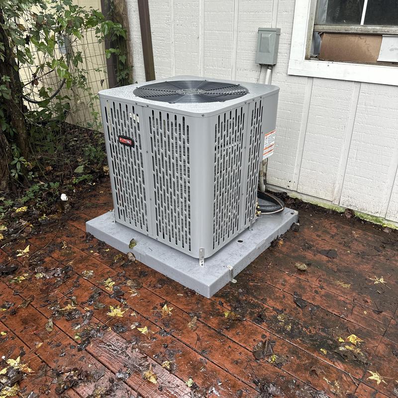 2.5 ton air conditioning condenser unit installed outdoors