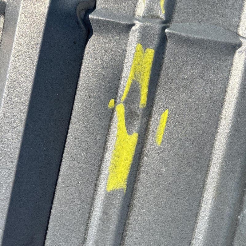 Metal roof panel with yellow inspection markings