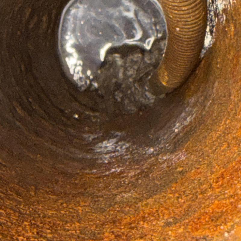 Cast iron sewer pipe with drain cleaning snake inside