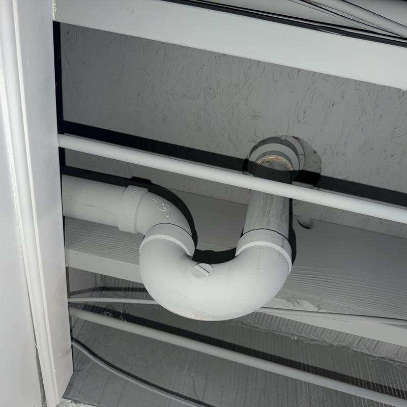 PVC shower drain trap under bathtub