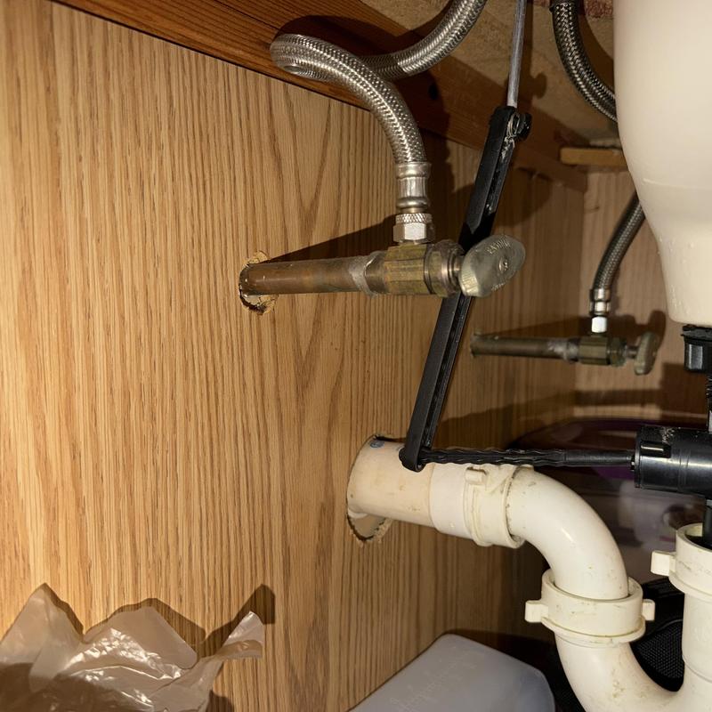 Under-sink water supply valve and drain piping connections