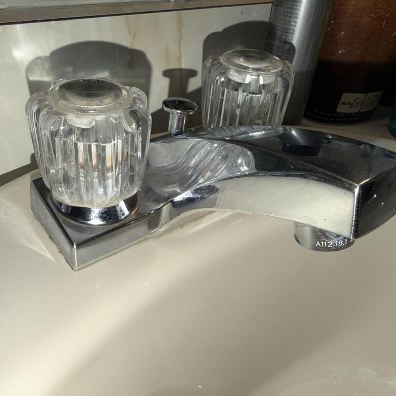 Bathroom sink faucet with clear plastic handles