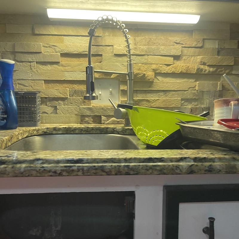 Kitchen faucet and sink area with drying dishes Kitchen faucet and sink area with drying dishes