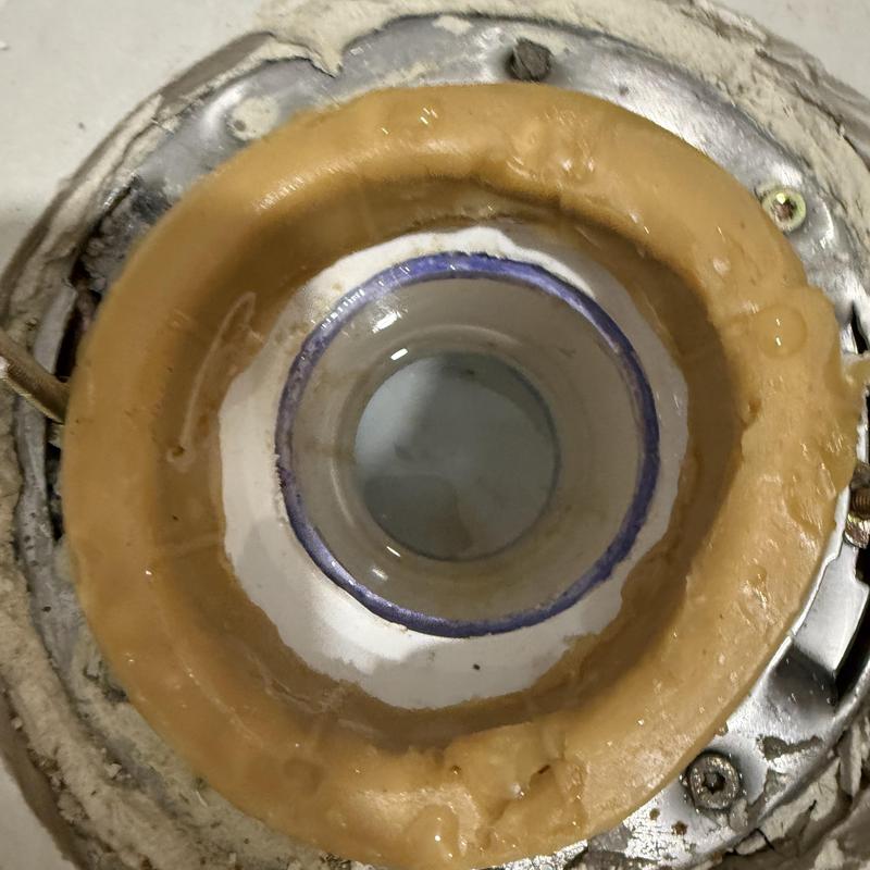 Toilet flange with sealant and mounting screws Toilet flange with sealant and mounting screws