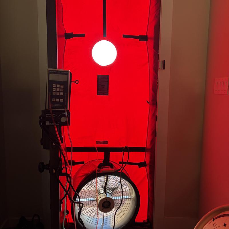 Blower door test equipment setup for energy audit