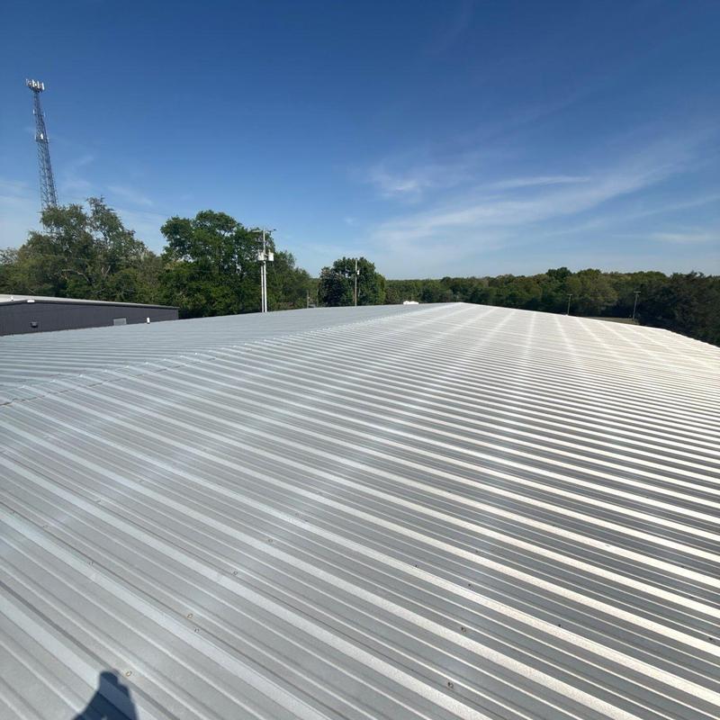 Metal roofing panels on commercial building roof