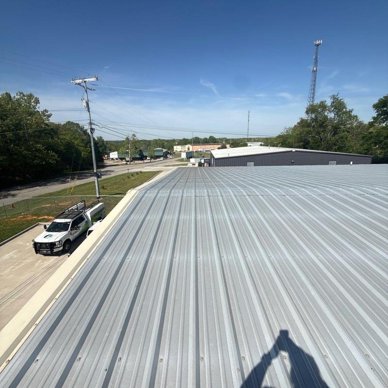 Metal roofing panels on commercial building roof