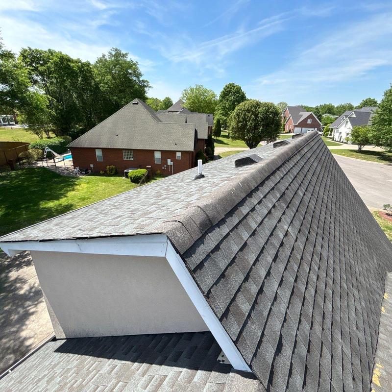 Asphalt shingle roof with ridge vent in residential area