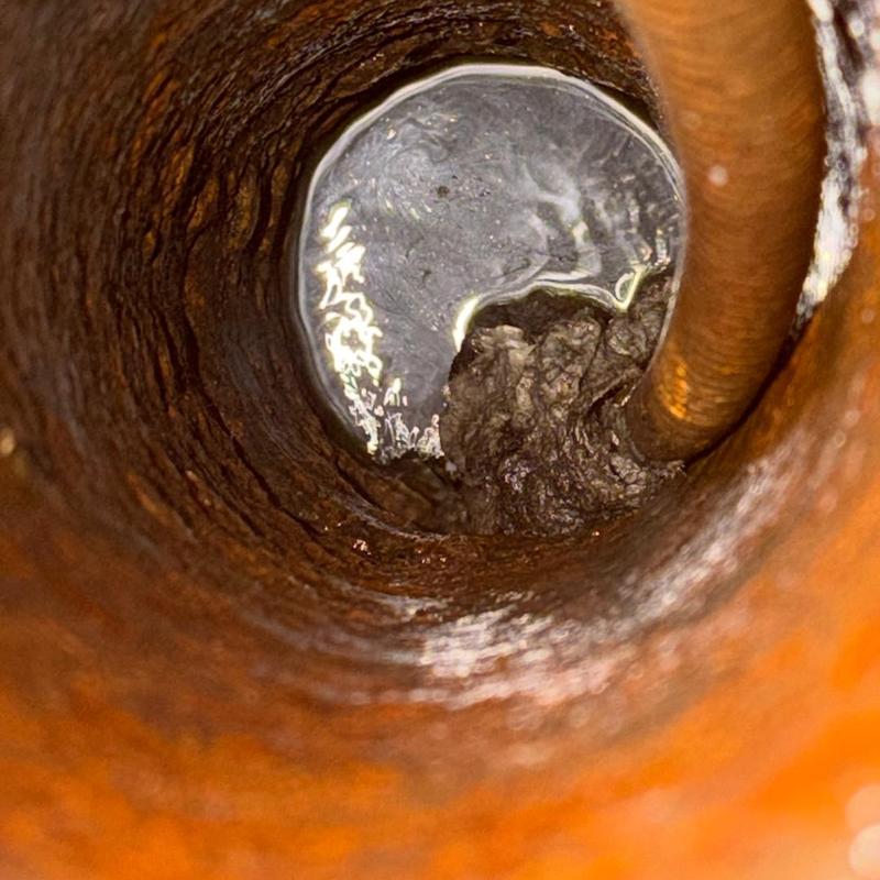 House trap drain clog inside pipe with buildup