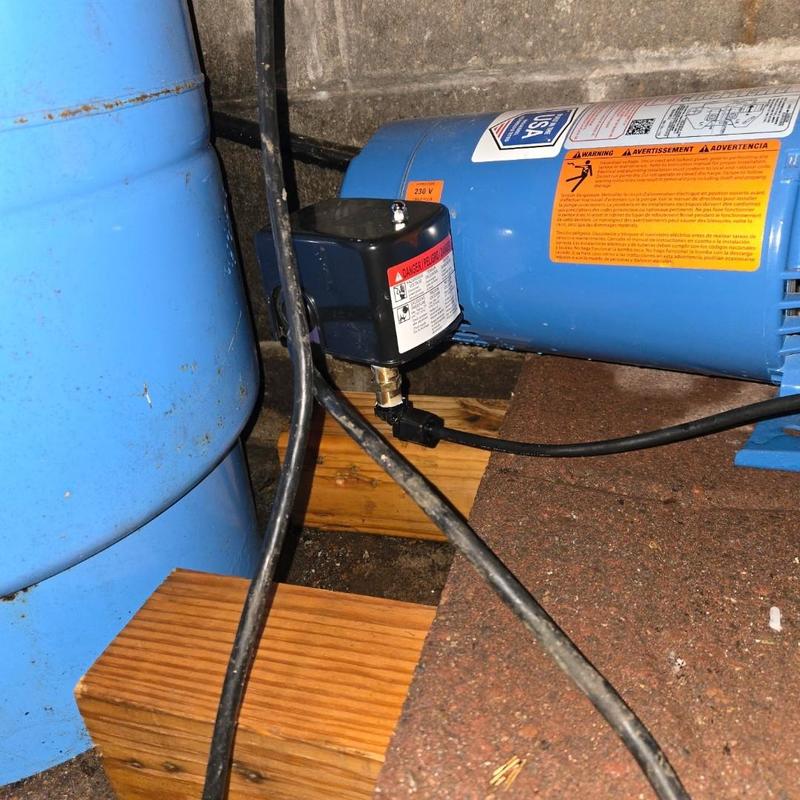 Pressure switch on blue water tank and pump system