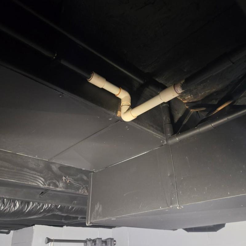 CPVC piping with elbow joints in ceiling space
