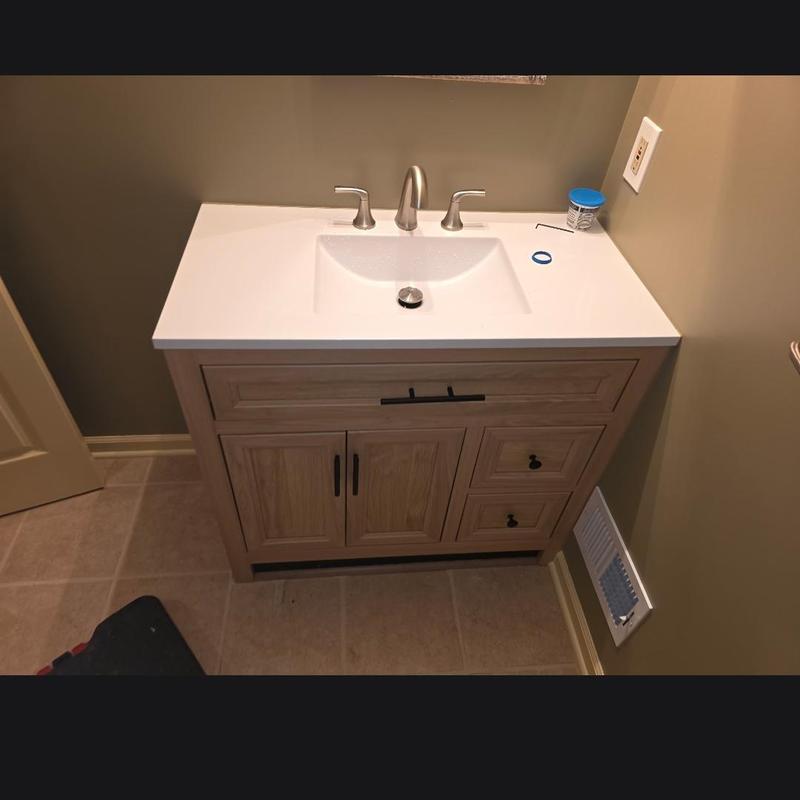 Widespread faucet and bathroom vanity installation