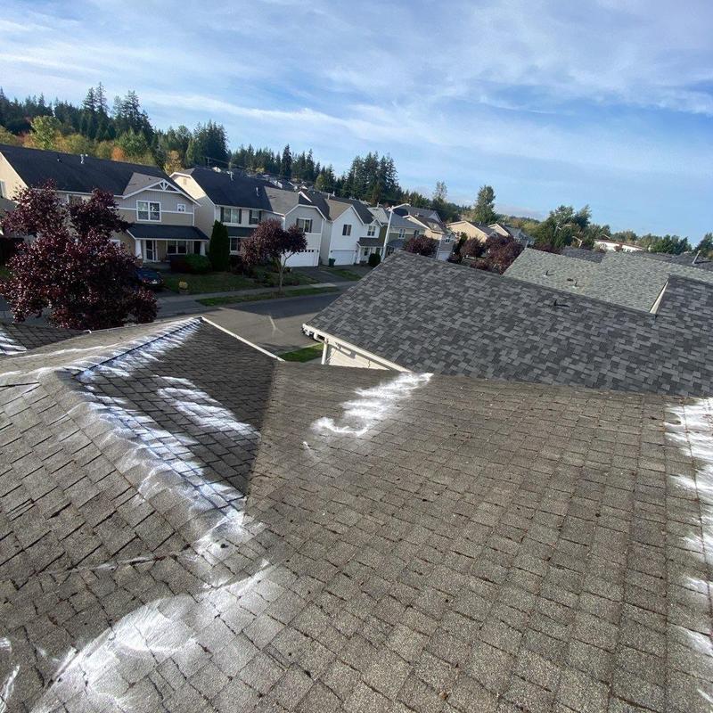Asphalt shingle roof with chalk markings for repair