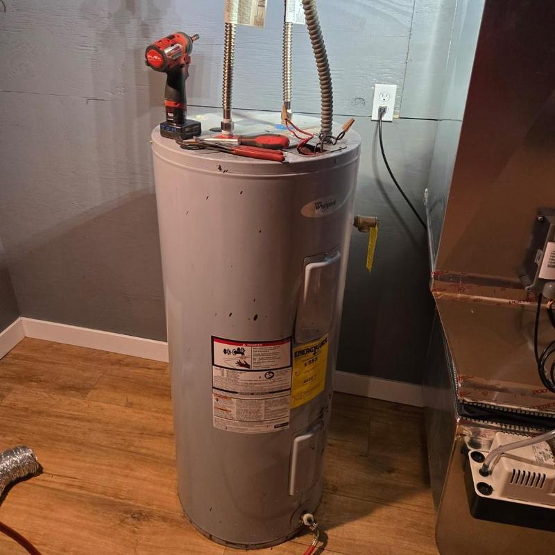 Water heater with tools for replacement job