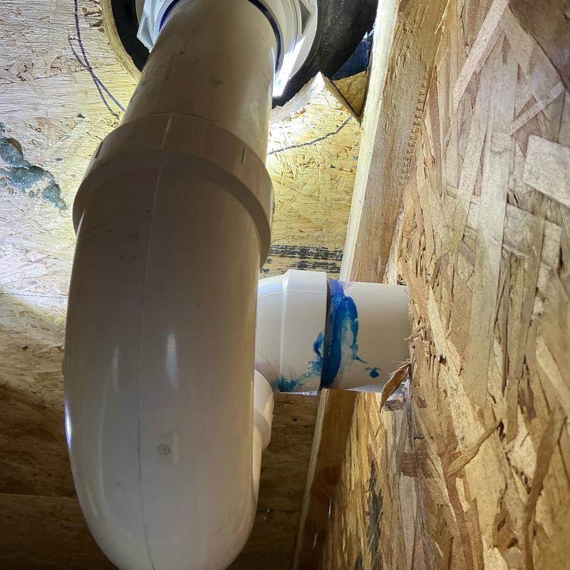 Shower drain and P-trap plumbing installation between floors