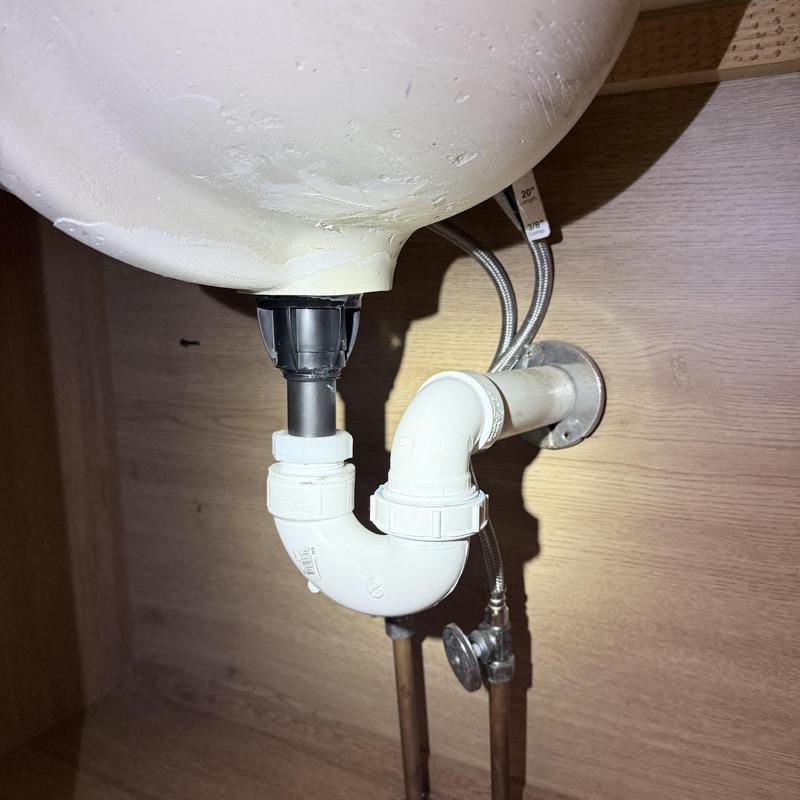 Lavatory sink P-trap and supply lines under cabinet