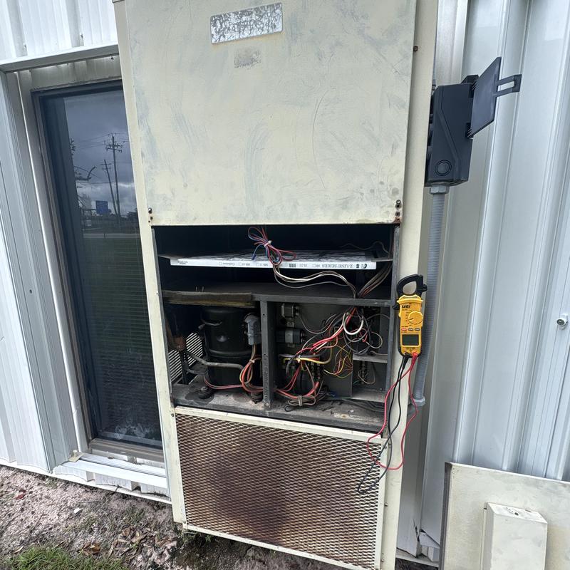 Commercial HVAC compressor unit with electrical testing tools Commercial HVAC compressor unit with electrical testing tools