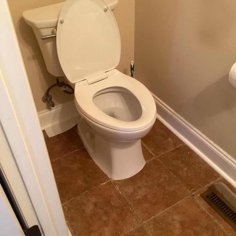 Elongated ADA height white toilet installation Elongated ADA height white toilet installation