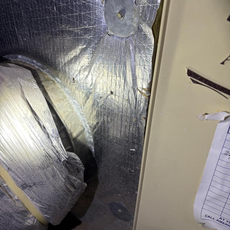 HVAC duct insulation and foil wrap in attic space