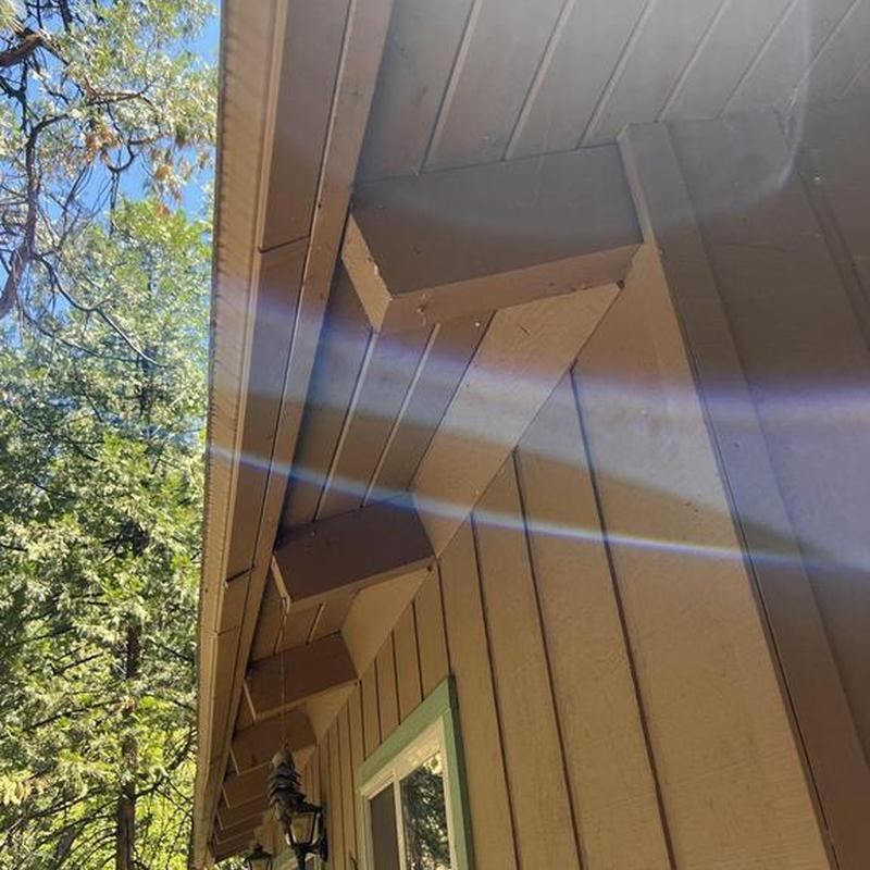 Cabin fascia and soffit trim with sunlight glare