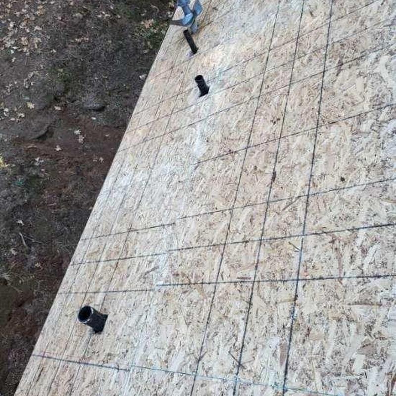 Oriented strand board roof decking with vent pipes